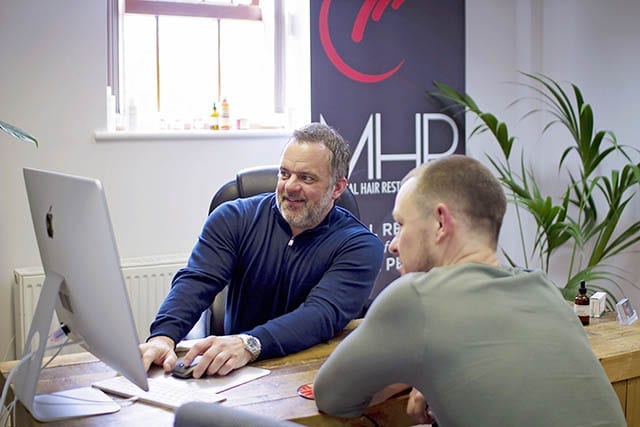 Rickitt inside our Hair transplant clinic Rickitt having a consultation with Craig Henton inside the Manchester hair transplant clinic